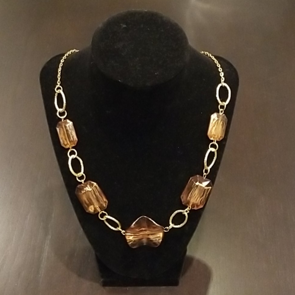 Womans gold and stone costume necklace